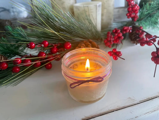  Homemade herb candles with soft flickering flames, casting a warm and cozy glow.