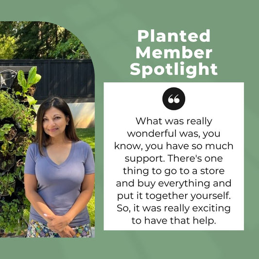 Naureen S. standing near her Planted Wall, which is a vertical garden on wheels. 